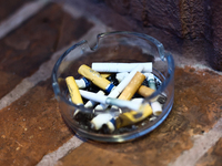 Cigarette butts are seen in the ashtray in Krakow, Poland on September 26, 2024. (