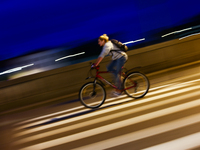 A cycler rides a bicycle in Krakow, Poland on September 26, 2024. (