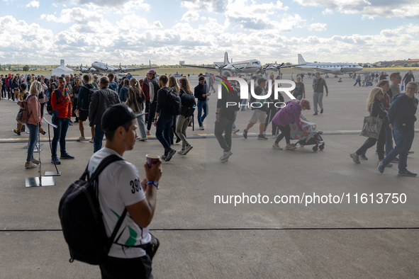 Competitors gather at the historic Tempelhof Airport in Berlin, Germany, on September 27, 2024, in preparation for the 50th edition of the B...