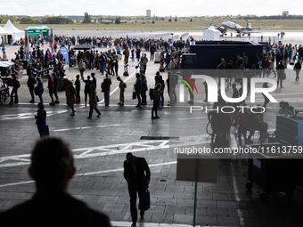 Competitors gather at the historic Tempelhof Airport in Berlin, Germany, on September 27, 2024, in preparation for the 50th edition of the B...