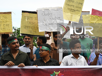 Activists of the Minority Rights Movement hold a protest rally before a torch march demanding justice for the attacks on the minority commun...