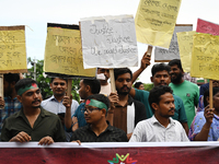 Activists of the Minority Rights Movement hold a protest rally before a torch march demanding justice for the attacks on the minority commun...