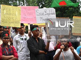 Activists of the Minority Rights Movement hold a protest rally before a torch march demanding justice for the attacks on the minority commun...