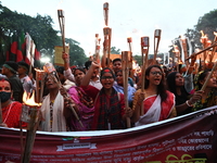 Activists of the Minority Rights Movement hold a torch march demanding justice for the attacks on the minority community in various parts of...