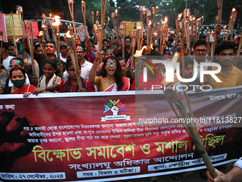 Activists of the Minority Rights Movement hold a torch march demanding justice for the attacks on the minority community in various parts of...