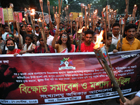 Activists of the Minority Rights Movement hold a torch march demanding justice for the attacks on the minority community in various parts of...