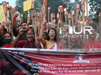 Activists of the Minority Rights Movement hold a torch march demanding justice for the attacks on the minority community in various parts of...