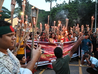 Activists of the Minority Rights Movement hold a torch march demanding justice for the attacks on the minority community in various parts of...