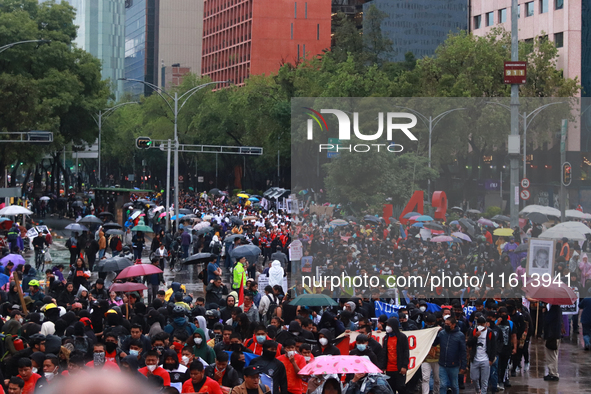 Demonstrators take part in a protest in support of the parents of the rural student victims to demand justice during the 10th anniversary of...