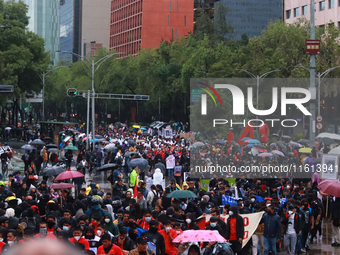 Demonstrators take part in a protest in support of the parents of the rural student victims to demand justice during the 10th anniversary of...