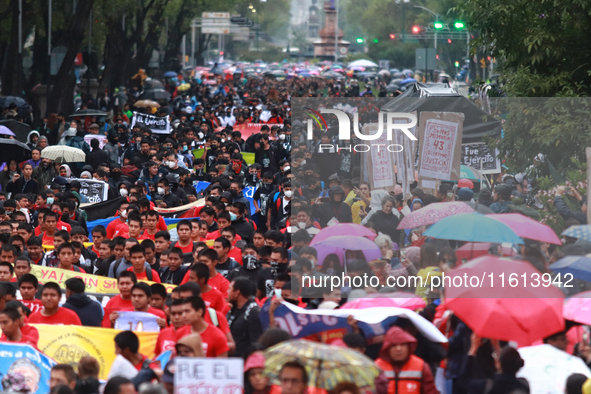 Demonstrators take part in a protest in support of the parents of the rural student victims to demand justice during the 10th anniversary of...