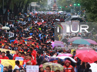 Demonstrators take part in a protest in support of the parents of the rural student victims to demand justice during the 10th anniversary of...