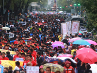 Demonstrators take part in a protest in support of the parents of the rural student victims to demand justice during the 10th anniversary of...