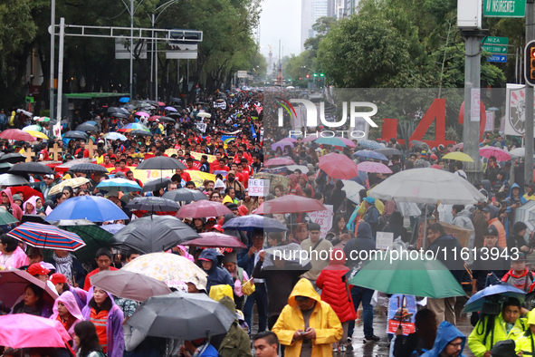 Demonstrators take part in a protest in support of the parents of the rural student victims to demand justice during the 10th anniversary of...