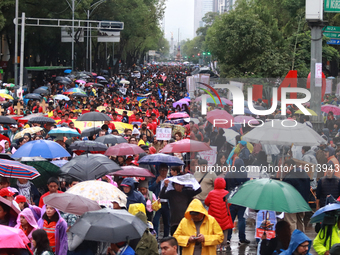 Demonstrators take part in a protest in support of the parents of the rural student victims to demand justice during the 10th anniversary of...