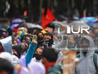 Rural students participate in a protest in support of the parents of the rural student victims to demand justice during the 10th anniversary...