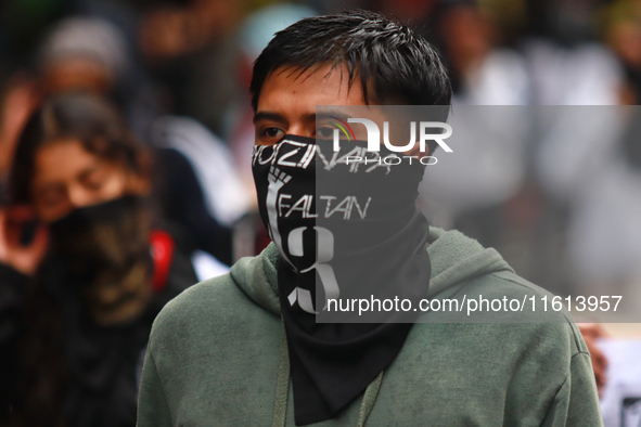 A rural student takes part in a protest in support of the parents of the rural student victims to demand justice during the 10th anniversary...