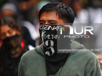 A rural student takes part in a protest in support of the parents of the rural student victims to demand justice during the 10th anniversary...