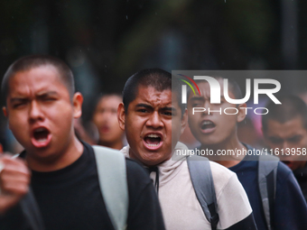 Rural students participate in a protest in support of the parents of the rural student victims to demand justice during the 10th anniversary...