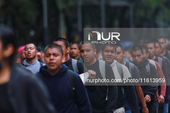 Rural students participate in a protest in support of the parents of the rural student victims to demand justice during the 10th anniversary...