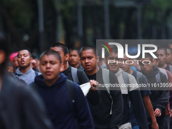 Rural students participate in a protest in support of the parents of the rural student victims to demand justice during the 10th anniversary...