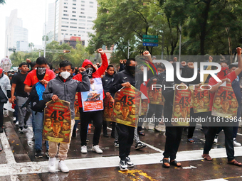 Rural students participate in a protest in support of the parents of the rural student victims to demand justice during the 10th anniversary...