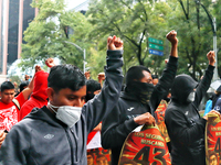 Rural students participate in a protest in support of the parents of the rural student victims to demand justice during the 10th anniversary...