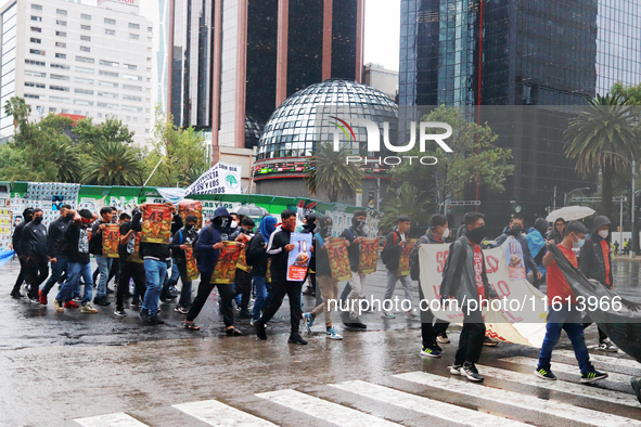 Rural students participate in a protest in support of the parents of the rural student victims to demand justice during the 10th anniversary...