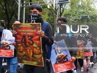 Rural students participate in a protest in support of the parents of the rural student victims to demand justice during the 10th anniversary...