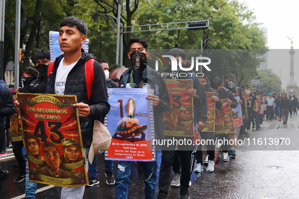 Rural students participate in a protest in support of the parents of the rural student victims to demand justice during the 10th anniversary...