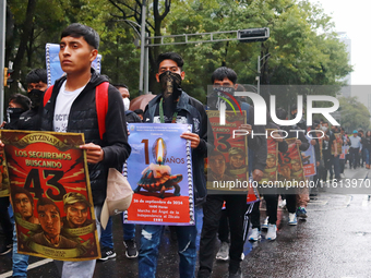 Rural students participate in a protest in support of the parents of the rural student victims to demand justice during the 10th anniversary...