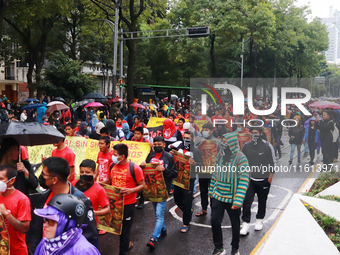 Rural students participate in a protest in support of the parents of the rural student victims to demand justice during the 10th anniversary...