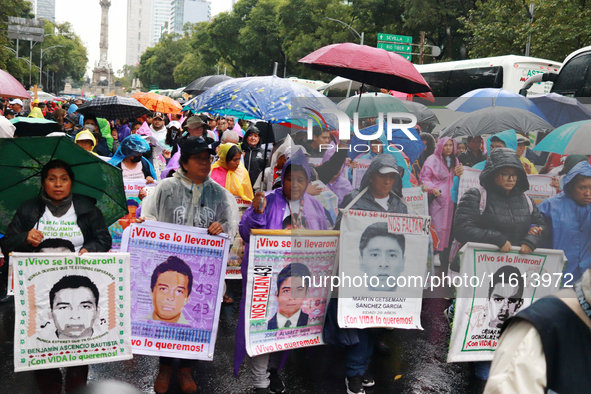 Parents of the rural student victims take part in a protest to demand justice on the 10th anniversary of the forced disappearance of the 43...