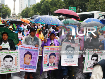 Parents of the rural student victims take part in a protest to demand justice on the 10th anniversary of the forced disappearance of the 43...