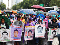 Parents of the rural student victims take part in a protest to demand justice on the 10th anniversary of the forced disappearance of the 43...