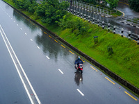 People's daily lives are affected by the heavy rainfall in Kathmandu, Nepal, on September 27, 2024. People wear raincoats and travel to thei...