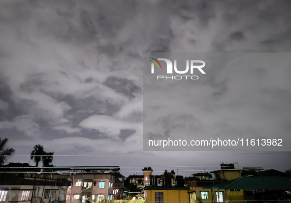 Dark rain clouds appear on the skyline in Siliguri, India, on September 27, 2024. Four people die due to a thunderstorm and lightning in the...