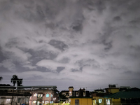 Dark rain clouds appear on the skyline in Siliguri, India, on September 27, 2024. Four people die due to a thunderstorm and lightning in the...