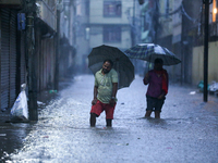 People wade through the flood water in Kathmandu, Nepal, on September 27, 2024. The Himalayan nation witnesses downpour after the activation...