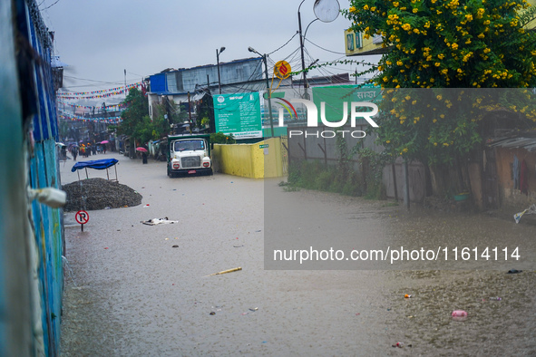 The Bagmati River floods and affects the riverbanks and homes during heavy rainfall in Kathmandu, Nepal, on September 27, 2024. 