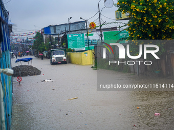 The Bagmati River floods and affects the riverbanks and homes during heavy rainfall in Kathmandu, Nepal, on September 27, 2024. (