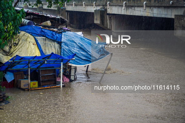 The Bagmati River floods and affects the riverbanks and homes during heavy rainfall in Kathmandu, Nepal, on September 27, 2024. 