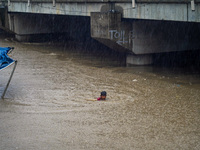 People's daily lives are affected due to heavy rainfall and flooding of the Bagmati River in Kathmandu, Nepal, on September 27, 2024. (