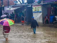 People's daily lives are affected due to heavy rainfall and flooding of the Bagmati River in Kathmandu, Nepal, on September 27, 2024. (