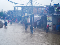 People's daily lives are affected due to heavy rainfall and flooding of the Bagmati River in Kathmandu, Nepal, on September 27, 2024. (