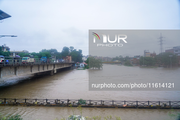 The Bagmati River floods and affects the riverbanks and homes during heavy rainfall in Kathmandu, Nepal, on September 27, 2024. 