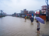 People's daily lives are affected due to heavy rainfall and flooding of the Bagmati River in Kathmandu, Nepal, on September 27, 2024. (