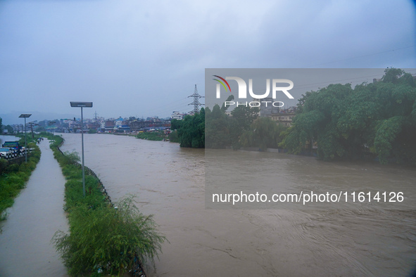 The Bagmati River floods and affects the riverbanks and homes during heavy rainfall in Kathmandu, Nepal, on September 27, 2024. 