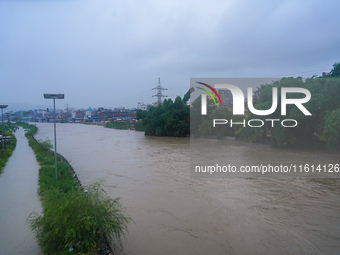 The Bagmati River floods and affects the riverbanks and homes during heavy rainfall in Kathmandu, Nepal, on September 27, 2024. (