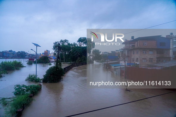 The Bagmati River floods and affects the riverbanks and homes during heavy rainfall in Kathmandu, Nepal, on September 27, 2024. 